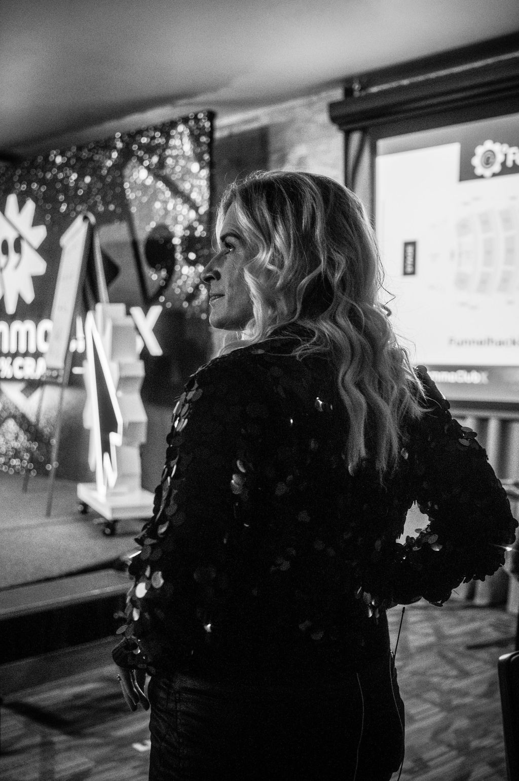 Black and white profile of Sarah Grace Allred near the 2CCX stage
